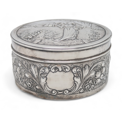 2519 - AN EDWARDIAN SILVER CIRCULAR BOXby Blackburn & Tysall, London 1903, the lid with repousse decora... 