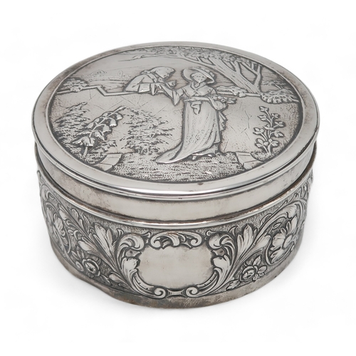 2519 - AN EDWARDIAN SILVER CIRCULAR BOXby Blackburn & Tysall, London 1903, the lid with repousse decora... 