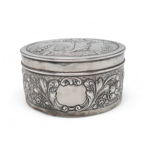 2519 - AN EDWARDIAN SILVER CIRCULAR BOXby Blackburn & Tysall, London 1903, the lid with repousse decora... 