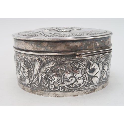 2519 - AN EDWARDIAN SILVER CIRCULAR BOXby Blackburn & Tysall, London 1903, the lid with repousse decora... 