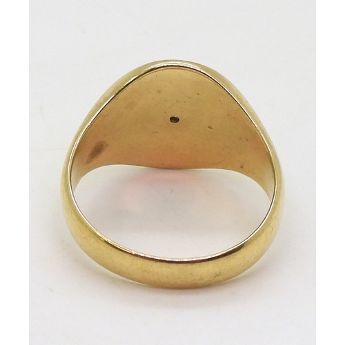 9008 - A diamond set oval faced signet ring, size X, weight 9.8gms (1)