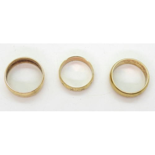 9014 - Three 9ct gold wedding rings, star engraved size Q, 'D' shape T1/2, other size V, weight together 15... 