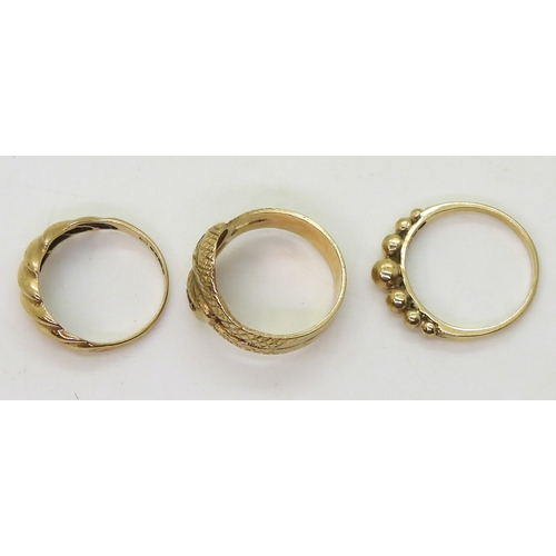 9020 - Three 9ct gold rings, a snake ring, size O1/2, a bobble ring size O1/2, and another size N, weight 8... 