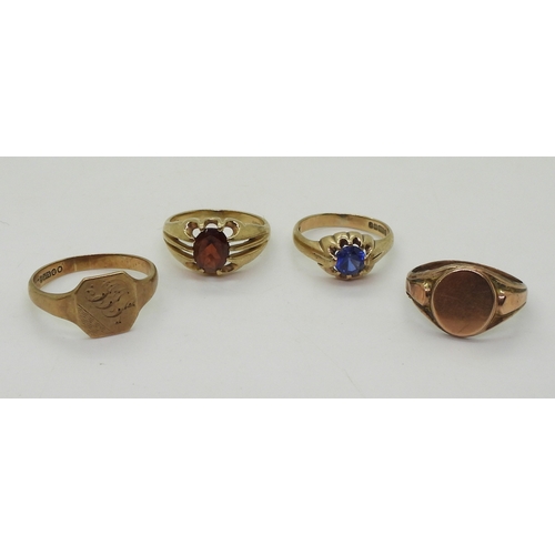 9022 - Four 9ct gold rings. Two signet rings, square faced, size W1/2, oval (hollow af) size R, a garnet se... 