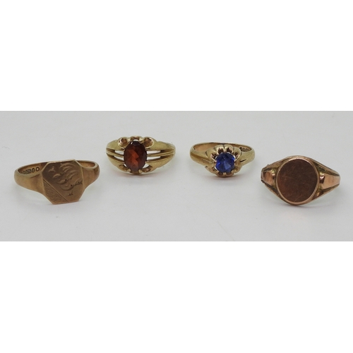 9022 - Four 9ct gold rings. Two signet rings, square faced, size W1/2, oval (hollow af) size R, a garnet se... 