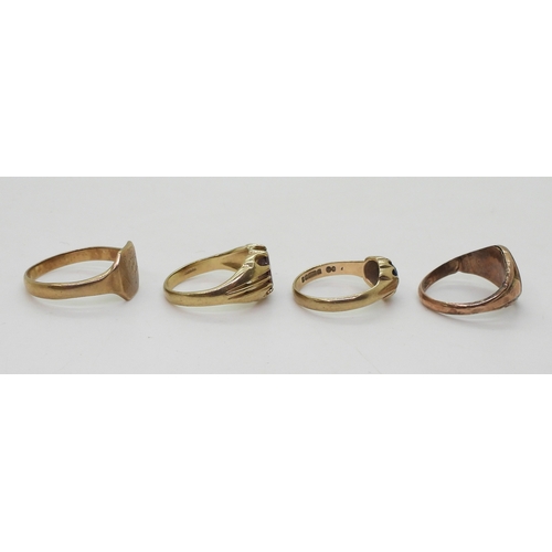 9022 - Four 9ct gold rings. Two signet rings, square faced, size W1/2, oval (hollow af) size R, a garnet se... 