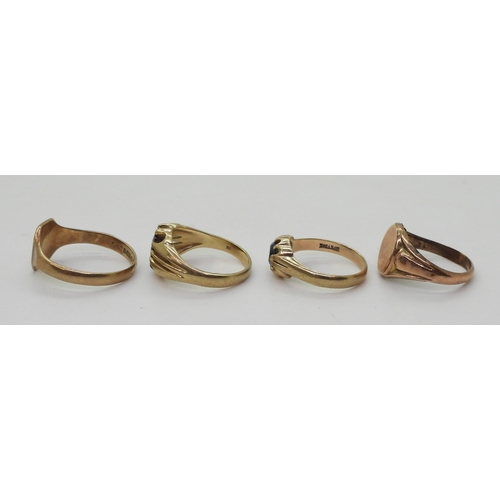 9022 - Four 9ct gold rings. Two signet rings, square faced, size W1/2, oval (hollow af) size R, a garnet se... 