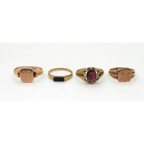 9024 - Four 9ct gold rings, garnet set gypsy size U,square signet size U, rose gold signet size Q, and an o... 