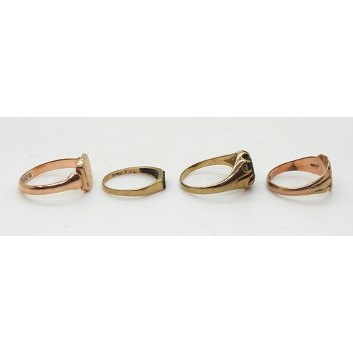 9024 - Four 9ct gold rings, garnet set gypsy size U,square signet size U, rose gold signet size Q, and an o... 