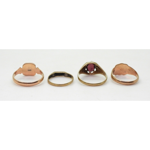 9024 - Four 9ct gold rings, garnet set gypsy size U,square signet size U, rose gold signet size Q, and an o... 