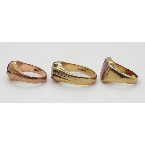 9028 - Three 9ct gold gem set rings, Cz gypsy ring size X, a 9ct Jayem pink glass signet, size P1/2, and a ... 