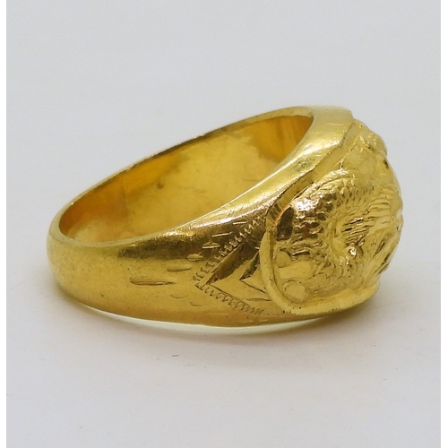 9030 - A Chinese dragon ring, in bright yellow metal with Chinese character stamps and 96.5%, finger size Y... 