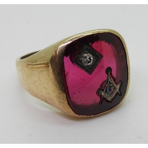 9031 - A 10k gold Masonic ring set with a diamond and red glass, size P1/2, weight 7.6gms, together with tw... 