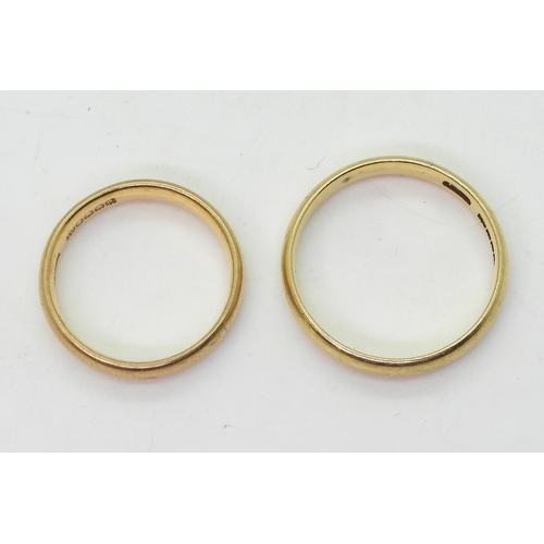 9033 - Two 18ct gold Glasgow hallmarked wedding rings, dated 1913 size W and 1925 size P1/2, weight 9.8gms