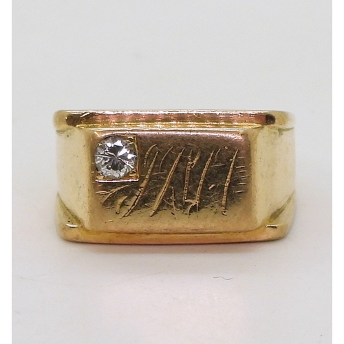 9054 - A yellow metal signet ring, lightly stamped 18k, set with a 0.15ct brilliant cut diamond, size t, we... 