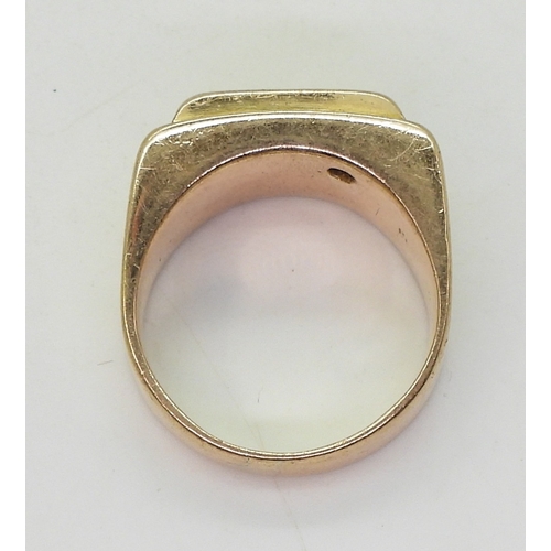 9054 - A yellow metal signet ring, lightly stamped 18k, set with a 0.15ct brilliant cut diamond, size t, we... 