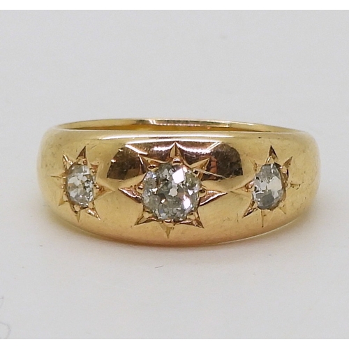 9063 - An 18ct rose gold three stone diamond ring, set with three star set old cut diamonds, hallmarked Che... 