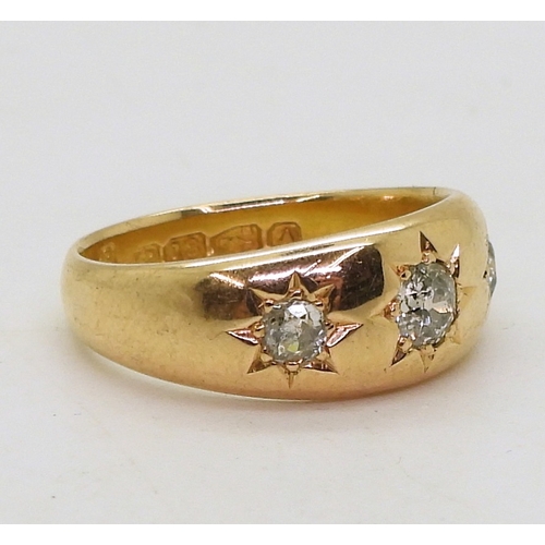 9063 - An 18ct rose gold three stone diamond ring, set with three star set old cut diamonds, hallmarked Che... 