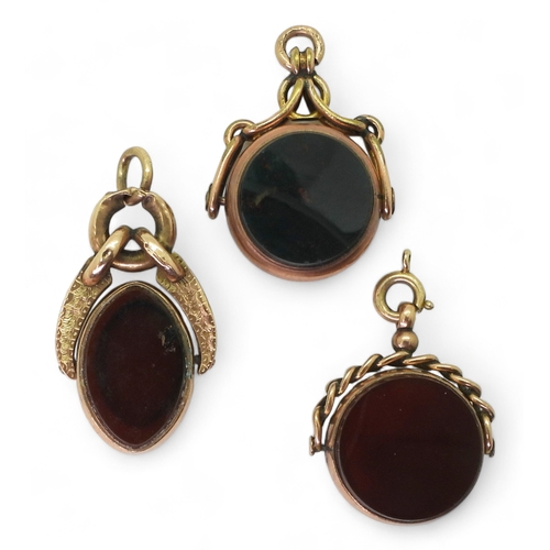 9122 - Three 9ct gold mounted fob seals set with bloodstone and carnelian, weight together 21.6gms