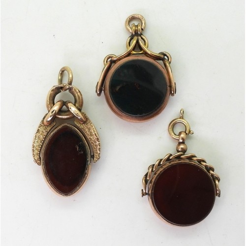 9122 - Three 9ct gold mounted fob seals set with bloodstone and carnelian, weight together 21.6gms