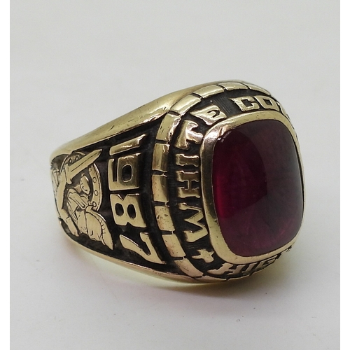 9127 - A 10k Josten's brand American college  ring, for White County High 1987, set with a pink glass gem, ... 