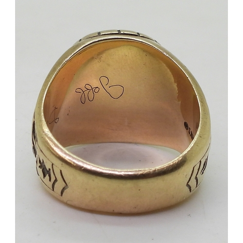 9127 - A 10k Josten's brand American college  ring, for White County High 1987, set with a pink glass gem, ... 