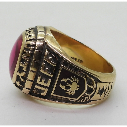 9127 - A 10k Josten's brand American college  ring, for White County High 1987, set with a pink glass gem, ... 