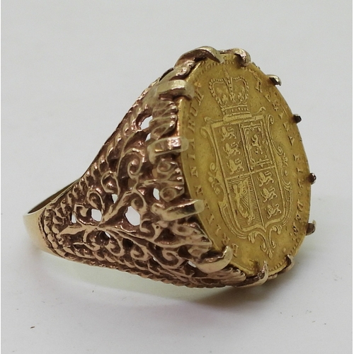 9128 - An 1863 Shield back gold half sovereign, in a decorative 9ct ring mount, size R1/2, weight 8.2gms