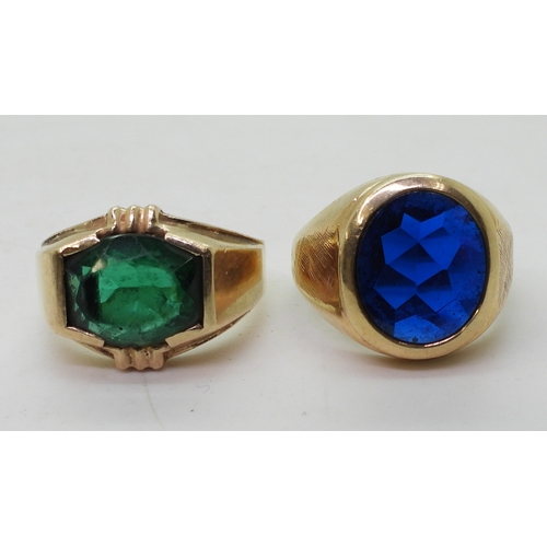 9129 - Two 10k gold rings set with glass gems, blue size T1/2, green size Q, weight combined 15.6gms