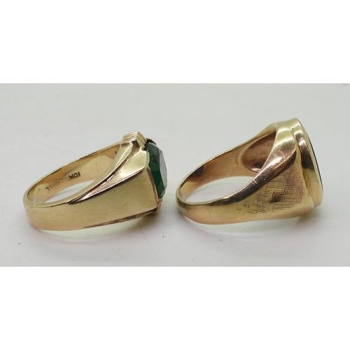 9129 - Two 10k gold rings set with glass gems, blue size T1/2, green size Q, weight combined 15.6gms