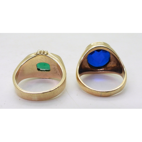 9129 - Two 10k gold rings set with glass gems, blue size T1/2, green size Q, weight combined 15.6gms