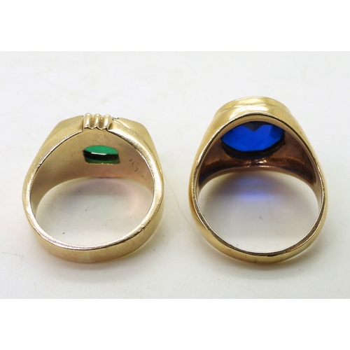 9129 - Two 10k gold rings set with glass gems, blue size T1/2, green size Q, weight combined 15.6gms