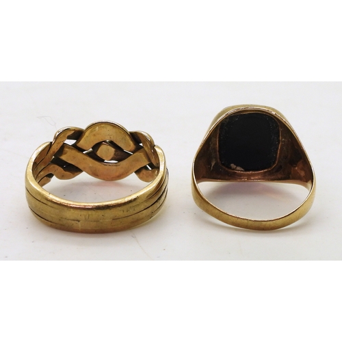 9131 - A 9ct gold puzzle ring, (soldered shut) size V, and a 9ct onyx signet ring, size R, weight together ... 