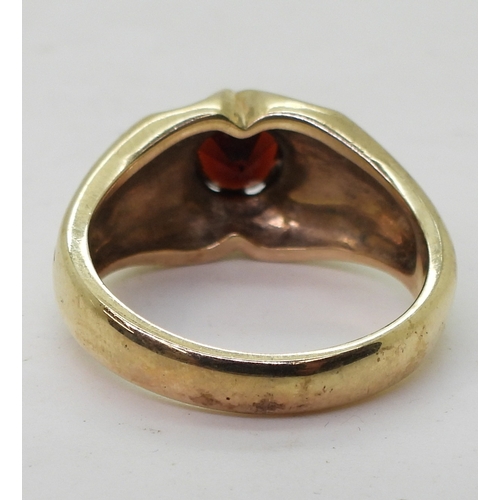 9137 - A 9ct gold garnet set Gypsy ring, size V, weight 10.2gms