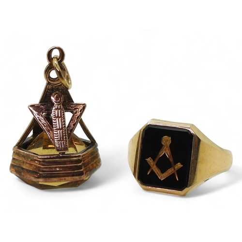 9140 - A 9ct gold carved onyx Masonic ring, size T1/2, together with a vintage Masonic citrine fob seal mad... 