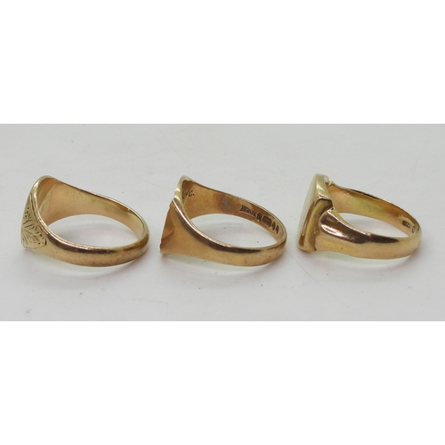 9141 - Three 9ct gold signet rings, monogrammed sunburst, size U1/2, square, size R1/2, oval, size U, weigh... 