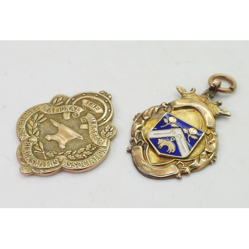 9143 - A 9ct gold the National Master Farriers & Blacksmiths Association medallion, (bail missing) toge... 