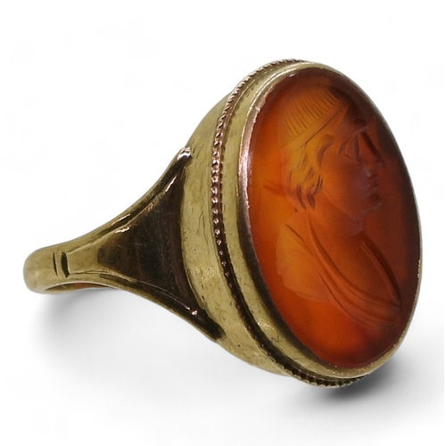 2762 - A CARNELIAN INTAGLIO RINGcarved with a gentleman, in a 9ct gold ring mount, finger size P1/2, weight... 