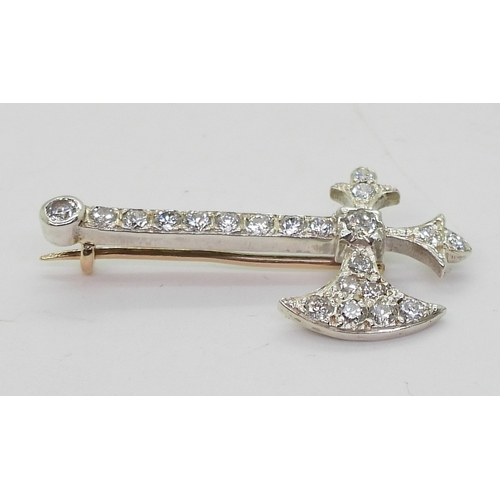 2763 - A DIAMOND AXE BROOCHset with estimated approx 0.80cts of brilliant cut diamonds, to the yellow and w... 