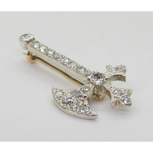 2763 - A DIAMOND AXE BROOCHset with estimated approx 0.80cts of brilliant cut diamonds, to the yellow and w... 