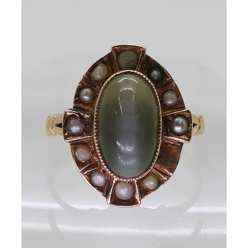 2764 - CATS EYE CHRYSOBERYL & PEARL RINGmounted in yellow metal, size of the chrysoberyl 11mm x 6.5mm x... 