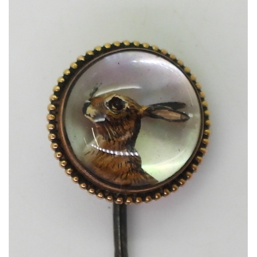 2768 - AN ESSEX CRYSTAL OF A HAREmounted on a slice of mother of pearl in a yellow metal mount with white m... 