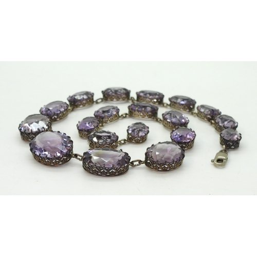 2771 - AN AMETHYST RIVIERA NECKLACEthe amethysts taper in size from 21.7mm x 16.5mm to 12.9mm x 9.7mm and a... 