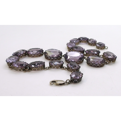 2771 - AN AMETHYST RIVIERA NECKLACEthe amethysts taper in size from 21.7mm x 16.5mm to 12.9mm x 9.7mm and a... 