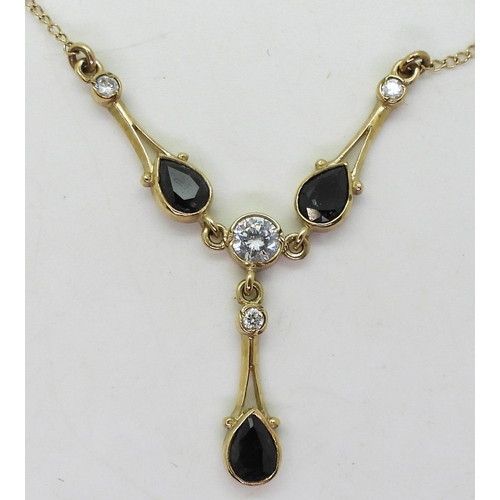 761 - A 9ct gold sapphire and cz decorative pendant necklet, chain length 46cm, weight 4.8gms