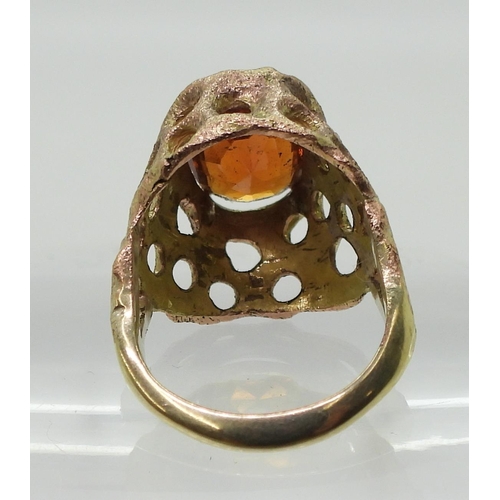 774 - A yellow metal retro ring set with an orange gem stone, size J, weight 6.1gms 