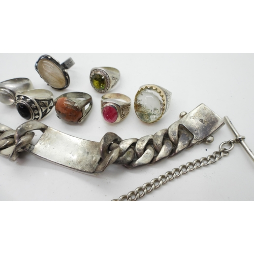 877 - A collection of silver and white metal to include a heavy curb chain bracelet with a 'Rolex' Design,... 