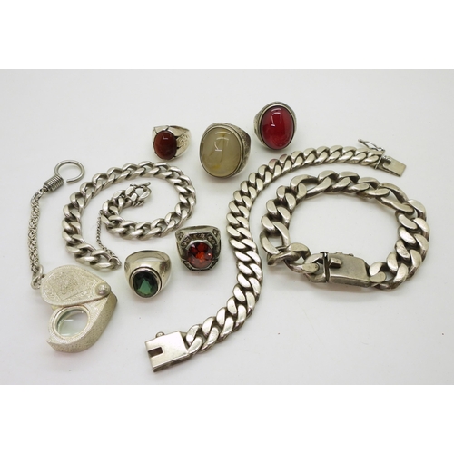 888 - Three white metal curb chain bracelets two stamped 925, a collection of white metal rings and a loop... 