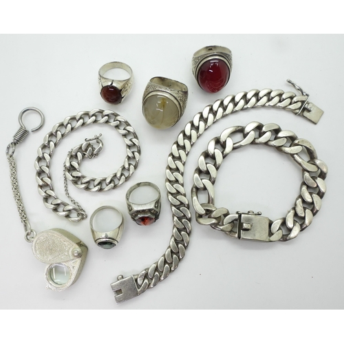 888 - Three white metal curb chain bracelets two stamped 925, a collection of white metal rings and a loop... 