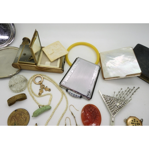 898 - A silver compact, hallmarked Birmingham 1941, a ladies compendium, a mother of pearl and crystal com... 